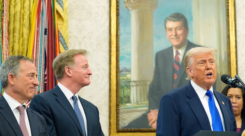 FILE - President Donald Trump speaks as Washington Commanders owner Josh Harris, from left, NFL Commissioner Roger Goodell and District of Columbia Mayor Muriel Bowser listen during an event in the Oval Office of the White House, May 5, 2025, in Washington. (AP Photo/Alex Brandon, File)