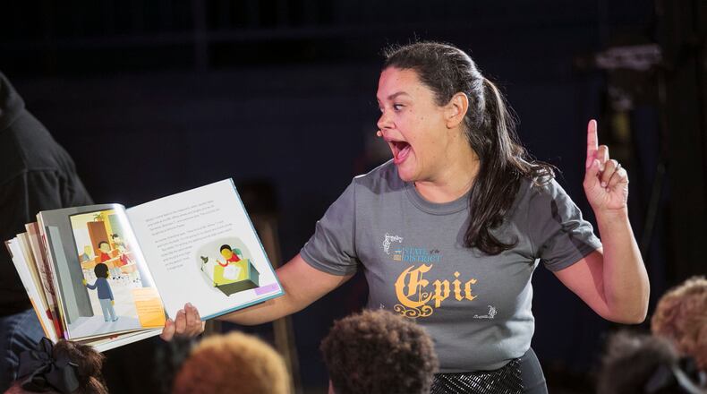 November 7, 2019 - Atlanta - Atlanta Public Schools Superintendent Meria Carstarphen reads to students as she closed out the event.  She delivered her final State of the District address at the newly renovated Harper-Archer Elementary School.  The theme of this year's address was"The Epic of APS." The program also included a ribbon cutting celebrating the opening of the newly renovated school.  Bob Andres / robert.andres@ajc.com