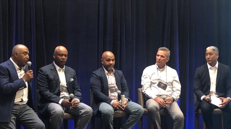 Former NFL head coaches Marvin Lewis, Jim Caldwell and Hue Jackson are on a panel with former Ohio State head coach Urban Meyer. The panel at the Quarterback Coaching Summit was moderated by Steve Wyche of the NFL Network. (By D. Orlando Ledbetter/dledbetter@ajc.com)