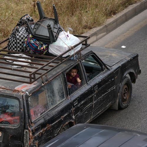 A family flees following an Israeli threat to strike Dahiyeh, Beirut's southern suburbs, Lebanon, Monday, June 1, 2026. (AP Photo/Bilal Hussein)