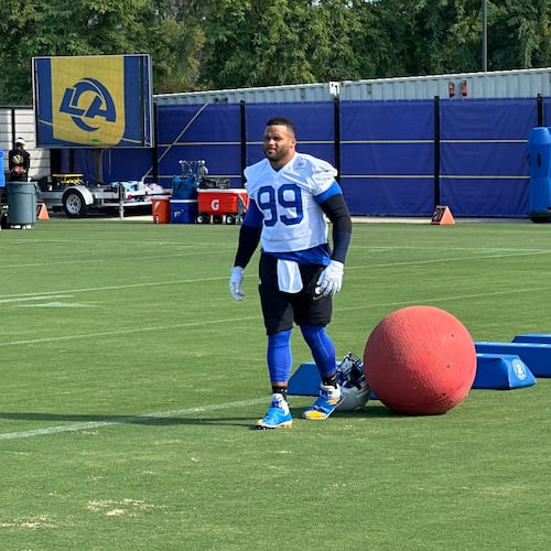 Aaron Donald takes the field for practice at the Los Angeles Rams' training complex in Los Angeles, Sunday, Aug. 30, 2026. (AP Photo/Greg Beacham)