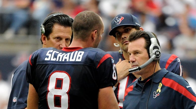 Houston Texans coach Gary Kubiak, right, talks with quarterback Matt Schaub (8) in the third quarter of an NFL football game against the Cleveland Browns on Sunday, Nov. 6, 2011, in Houston. (AP Photo/Dave Einsel)