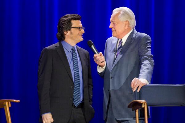 TCM hosts Ben Mankiewicz (left) and Robert Osborne celebrate the 20th anniversary of TCM at the Montalban Theatre during the 2014 TCM Classic Film Festival in Hollywood. (Mark Hill)