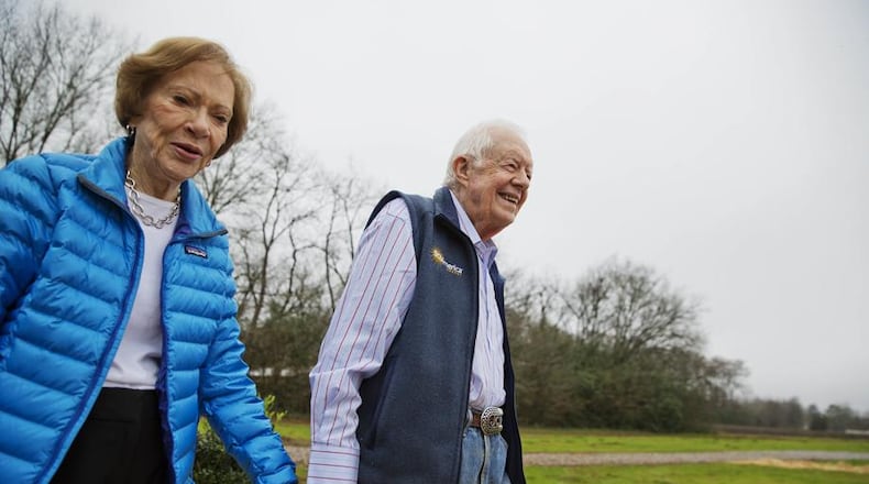 Former President Jimmy Carter, right, and his wife Rosalynn arrive for a ribbon cutting ceremony for a solar panel project on farmland he owns in their hometown of Plains, Ga., Wednesday, Feb. 8, 2017.  (AP Photo/David Goldman)