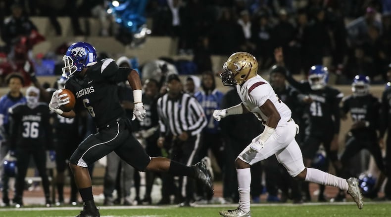 Stephenson running back Ryan Ingram (6) runs the ball while being pursued by Tucker High School's Jonovan Lowe (13), Friday, Nov. 2, 2018, in Clarkston, Ga. BRANDEN CAMP/SPECIAL