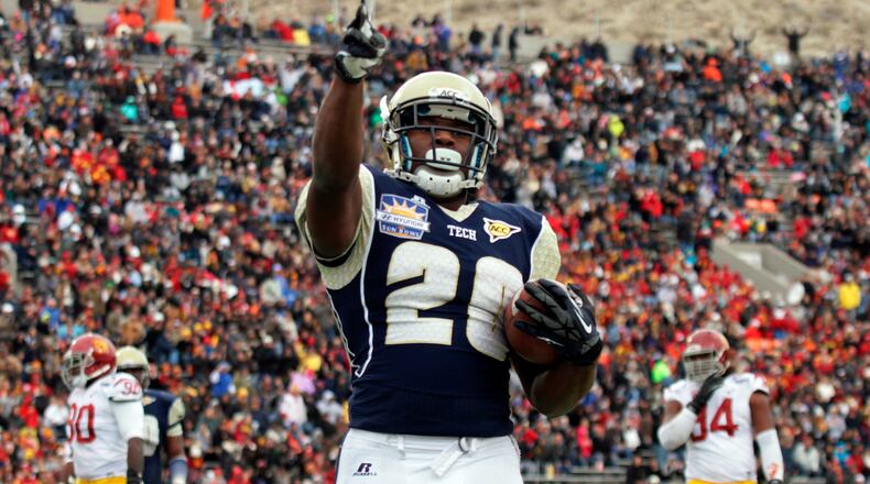 Georgia Tech running back David Sims celebrates his touchdown against Southern California during the first half of the Sun Bowl NCAA college football game, Monday, Dec. 31, 2012, in El Paso, Texas.