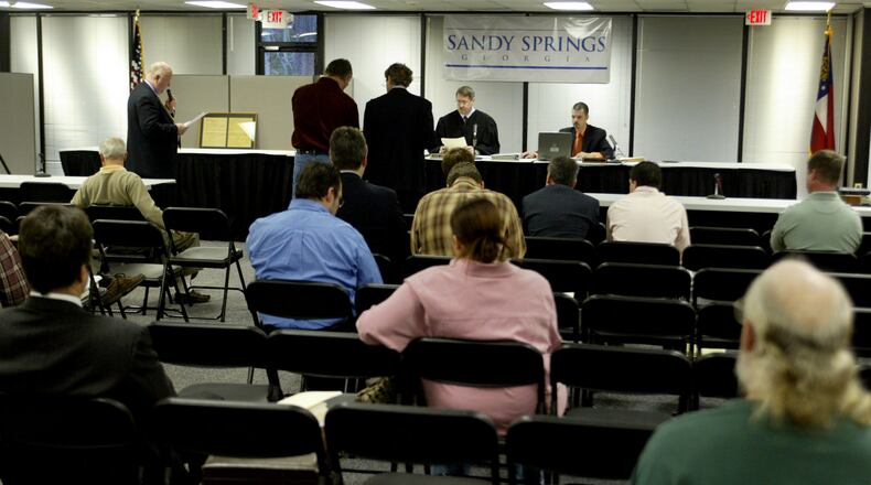 060217 - SANDY SPRINGS, GA -- The municipal court at Sandy Springs is in full swing, dispensing justice to scofflaw developers, wayward homeowners and incorrigible commercial operators who have been allowed to flout the law for years. They're being cited for cutting down significant trees, not containing stormwater runoff, littering, and not maintaining property, among other things. And the city is getting results. (PHIL SKINNER/AJC staff)