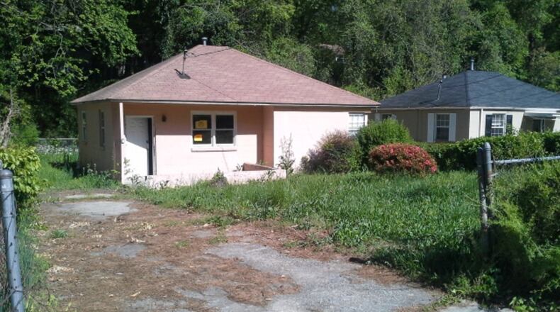 This Graymont Drive home is among the properties where Atlanta taxpayers footed the lawn-mowing bill. Atlanta Councilwoman Cleta Winslow paid a political ally more than $20,000 last year to mow lawns in her district, work that should have been bid out. Some of the properties were owned by banks and investors, but apparently no one was billed for the work.