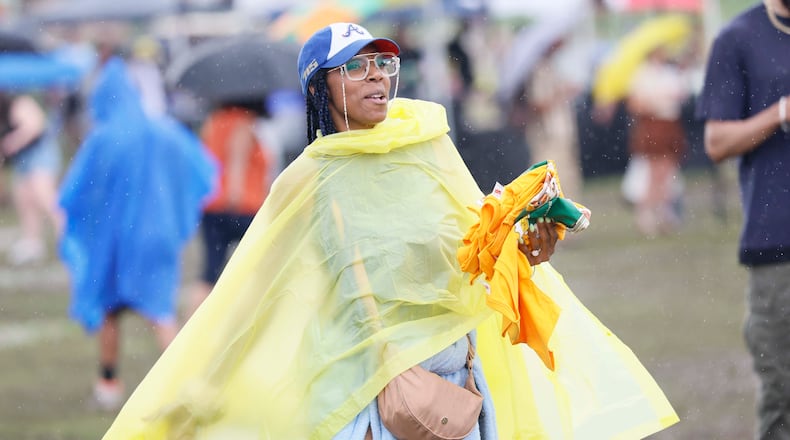 Fans heading downtown for the World Cup game or other festivities Thursday should bring an umbrella or rain poncho as heavy downpours are expected and will prompt the festival to close early. (Miguel Martinez/AJC)