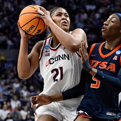 UConn forward Sarah Strong (21) is guarded by UTSA guard Mia Hammonds (5) during the first half in the first round of the NCAA college basketball tournament, Saturday, March 21, 2026, in Storrs, Conn. (AP Photo/Jessica Hill)