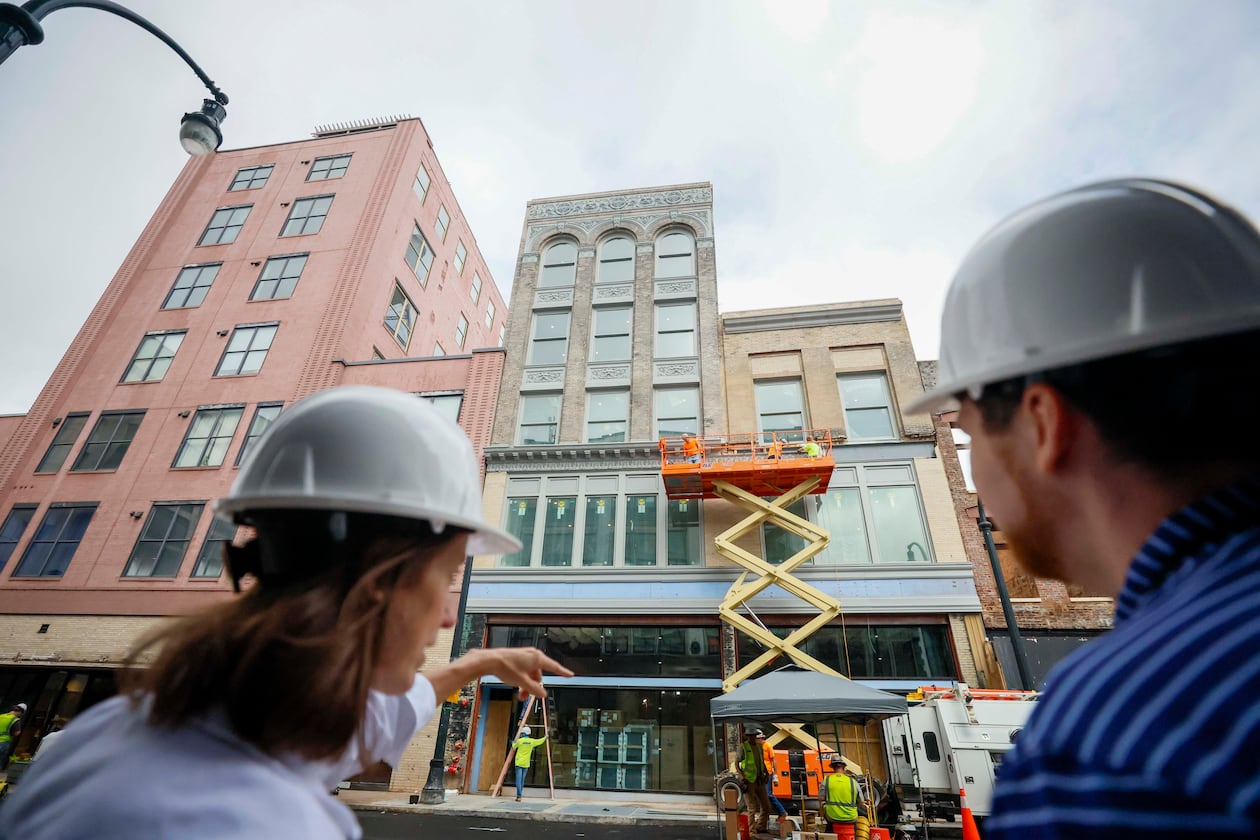 April Stammel, left, who leads marketing and community engagement with South Downtown, discusses the progress of work being done at 85 Peachtree during a tour of the area on Wednesday, May 27, 2026. Over 50 historic buildings are being restored to create retail and residential spaces in one of Atlanta’s most ambitious downtown projects. (Miguel Martinez/AJC)
