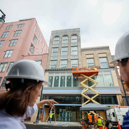 April Stammel, left, who leads marketing and community engagement with South Downtown, discusses the progress of work being done at 85 Peachtree during a tour of the area on Wednesday, May 27, 2026. Over 50 historic buildings are being restored to create retail and residential spaces in one of Atlanta’s most ambitious downtown projects. (Miguel Martinez/AJC)