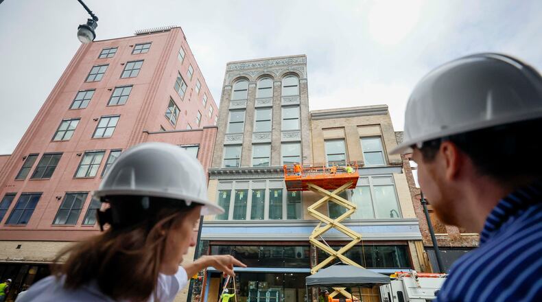 April Stammel, left, who leads marketing and community engagement with South Downtown, discusses the progress of work being done at 85 Peachtree during a tour of the area on Wednesday, May 27, 2026. Over 50 historic buildings are being restored to create retail and residential spaces in one of Atlanta’s most ambitious downtown projects. (Miguel Martinez/AJC)