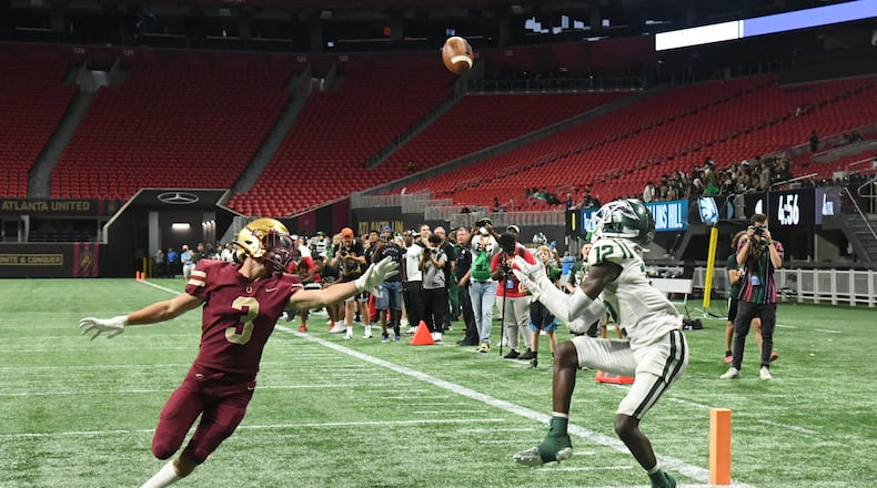 August 21, 2021 Atlanta - Collins HillÕs Travis Hunter (12) makes a touchdown pass during the 2021 Corky Kell Classic on Saturday, August 21, 2021. (Hyosub Shin / Hyosub.Shin@ajc.com)
