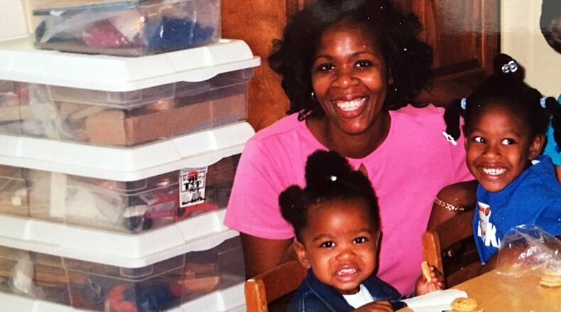 A metro Atlanta mother pays a visit to her childrens’ school. Forsyth County officials are working to increase such parental engagement as they work on revising their policy for FY 2018.