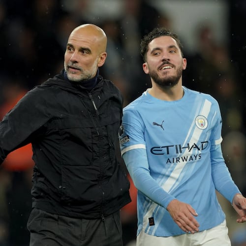 Manchester City's head coach Pep Guardiola, left, celebrates with Manchester City's Rayan Cherki at the end of the English Premier League soccer match between Manchester City and Crystal Palace in Manchester, England, Wednesday, May 13, 2026. (AP Photo/Ian Hodgson)