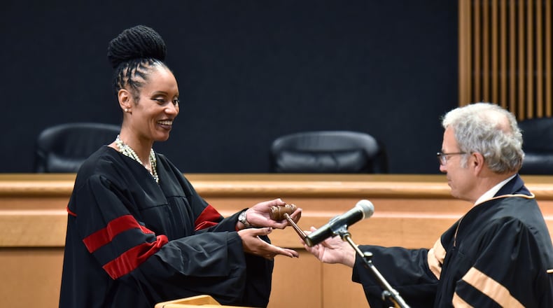 September 27, 2018 Lawrenceville - Gwinnett County State Court judge Ronda Colvin-Leary (left) receives a gavel from State Court Judge Joseph C. Iannazzone after she was sworn-in at the Gwinnett Justice and Administration Center on Thursday, September 27, 2018. Ronda Colvin-Leary was sworn in as a Gwinnett County State Court judge. She is the first African-American candidate to be elected to a countywide Gwinnett seat, as well as the first African-American to be elected to Gwinnett's state court bench. HYOSUB SHIN / HSHIN@AJC.COM