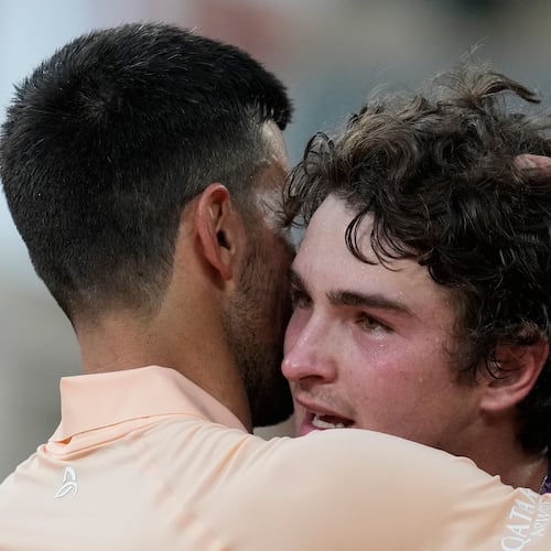 Novak Djokovic of Serbia, left, and Joao Fonseca of Brazil hug after their third round men's singles tennis match at the French Open tennis tournament in Paris, Friday, May 29, 2026. (AP Photo/Christophe Ena)