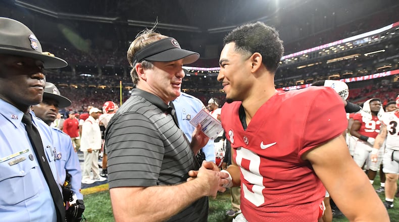 December 4, 2021 Atlanta - Georgia's head coach Kirby Smart talks to Alabama's quarterback Bryce Young (9) after Alabama beat Georgia during the Southeastern Conference championship NCAA college football game at during the Southeastern Conference championship NCAA college football game at Mercedes-Benz Stadium in Atlanta on Saturday, December 4, 2021. (Hyosub Shin / Hyosub.Shin@ajc.com)