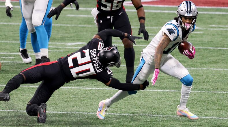 Carolina Panthers wide receiver Robby Anderson (11) runs after a catch against Atlanta Falcons cornerback Kendall Sheffield during the first quarter of the Oct. 11, 2020 Falcons-Panthers game at Mercedes-Benz Stadium. (Jason Getz/Special to the AJC)