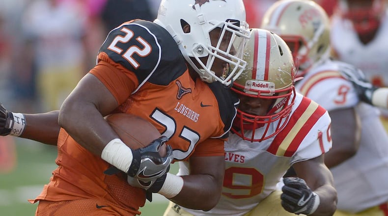 Rome defensive lineman Adam Anderson (19) makes a tackle. (Daniel Varnado/For the AJC)
