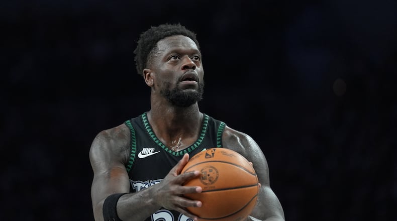 FILE - Minnesota Timberwolves forward Julius Randle shoots during the first half of Game 3 of a NBA basketball second-round playoff series against the San Antonio Spurs, May 8, 2026, in Minneapolis. (AP Photo/Abbie Parr, File)