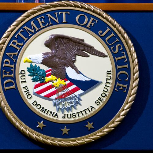 FILE - The Department of Justice seal is seen in Washington, Nov. 28, 2018. (AP Photo/Jose Luis Magana, File)