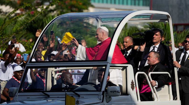 Pope Leo XIV waves after arriving in Luanda, Angola, Saturday, April 18, 2026 on the sixth day of his 11-day pastoral visit to Africa. (AP Photo/Themba Hadebe)