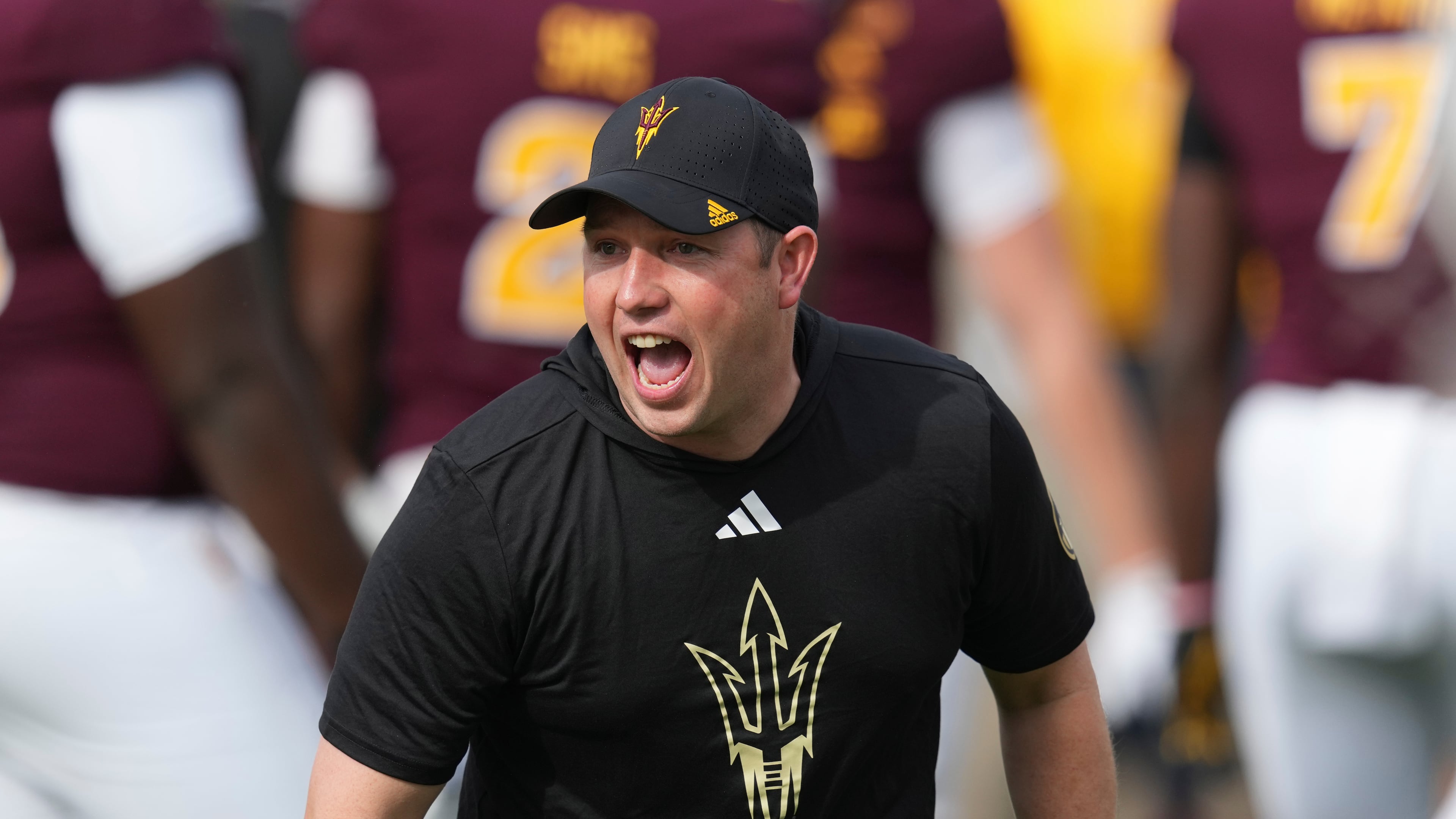 Arizona State head coach Kenny Dillingham encourages his players prior to an NCAA college football game against West Virginia Saturday, Nov. 15, 2025, in Tempe, Ariz. (AP Photo/Ross D. Franklin)