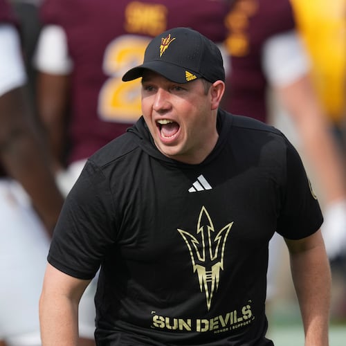 Arizona State head coach Kenny Dillingham encourages his players prior to an NCAA college football game against West Virginia Saturday, Nov. 15, 2025, in Tempe, Ariz. (AP Photo/Ross D. Franklin)