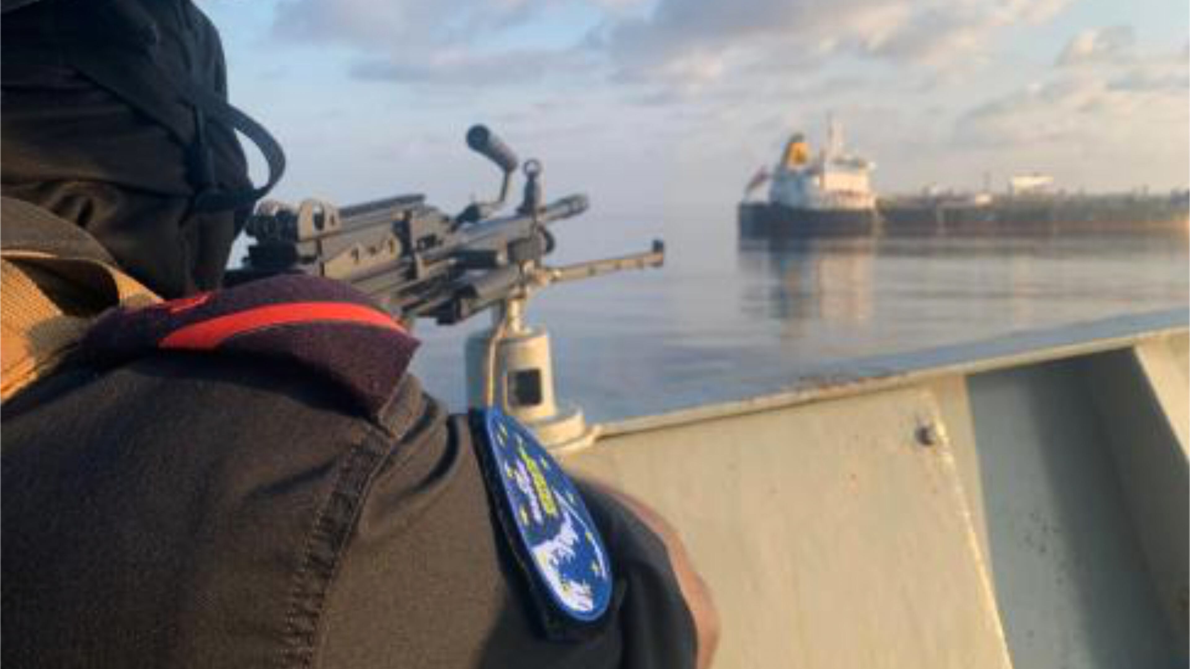 A member of the European Union's Operation Atalanta mans a machine gun aboard the ESPS Victoria while watching the Hellas Aphrodite off the coast of Somalia in the Arabian Sea on Friday, Nov. 7, 2025. (European Union's Operation Atalanta via AP)