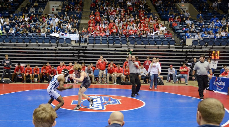 Archer's Samuel Bullard battles Camden County's Elerenzo Roberson in a 138-pound weight class during the GHSA State Dual Wrestling Championship in 2014 in Macon. Bullard won by a 6-5 decision.