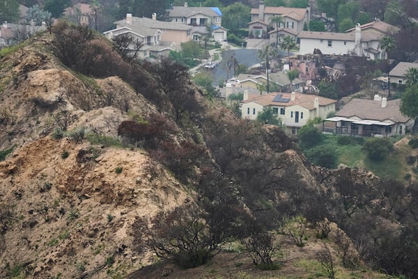 Burned homes are seen at La Viña gated community adjacent to the Chaney Trail Corridor, an area affected by the Eaton Fire, in Altadena, Calif., on Wednesday, April 23, 2025. (AP Photo/Damian Dovarganes)