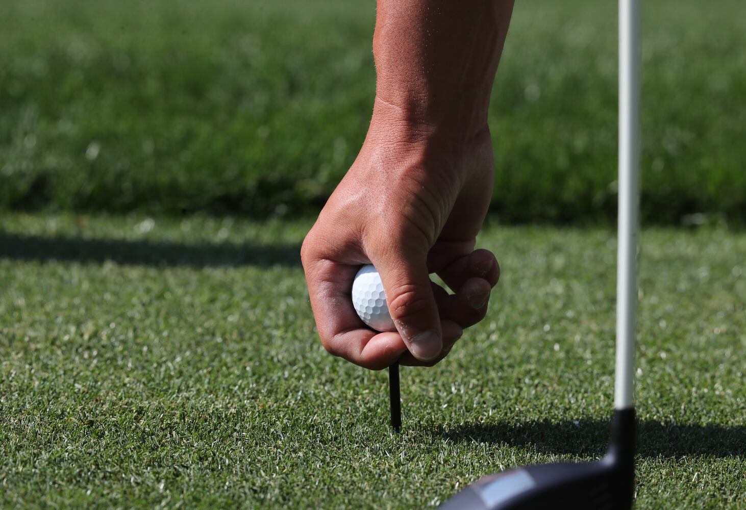 April 7, 2021, Augusta: Bryson DeChambeau places his ball  and tee as he prepares to tee off on the fourteenth hole during his practice round for the Masters at Augusta National Golf Club on Wednesday, April 7, 2021, in Augusta. Curtis Compton/ccompton@ajc.com