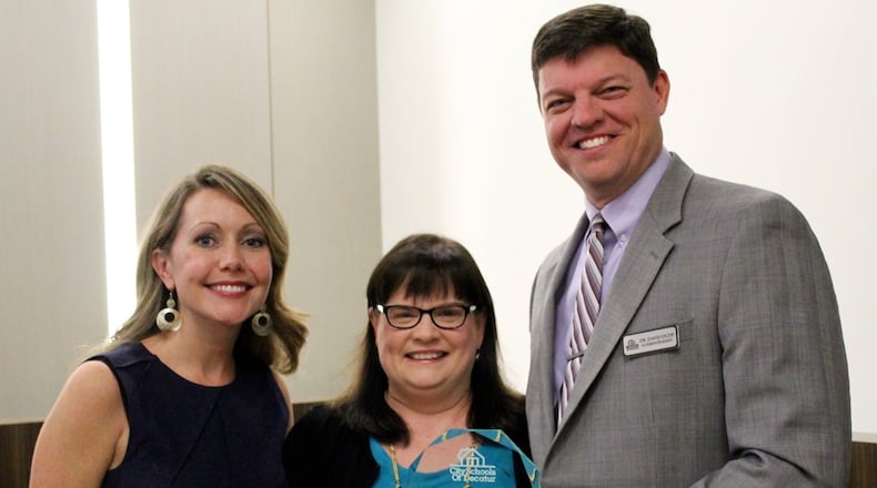 Decatur school board member Annie Caiola (left) shown here with Decatur High teacher Jenna Black and Superintendent David Dude. Caiola announced her resignation Monday night with 29 months left in her second term. Courtesy City Schools Decatur