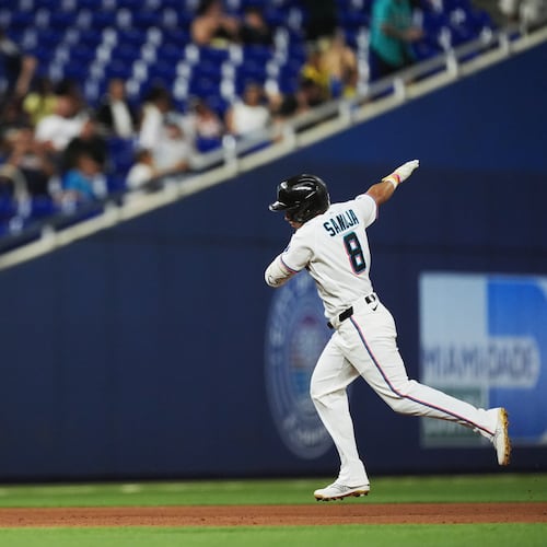 Miami Marlins' Javier Sanoja celebrates as he runs the bases after hitting a grand slam to bring home Jakob Marsee, Connor Norby, and Joe Mack, during the fifth inning of a baseball game against the Atlanta Braves, Monday, May 18, 2026, in Miami. (AP Photo/Rebecca Blackwell)
