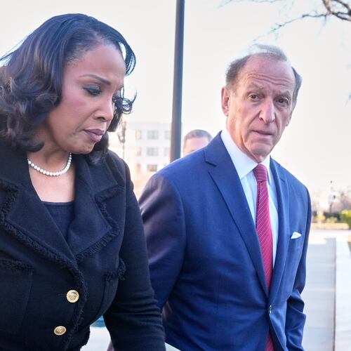 Federal Reserve governor Lisa Cook and attorney Abbe Lowell, arrive at the Supreme Court in Washington, Wednesday, Jan. 21, 2026. (AP Photo/Mark Schiefelbein)