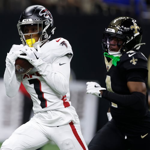Atlanta Falcons wide receiver Darnell Mooney (1) catches a pass for a touchdown against New Orleans Saints cornerback Kool-Aid McKinstry, right, in the second half of an NFL football game, Sunday, Nov. 23, 2025, in New Orleans. (AP Photo/Butch Dill)