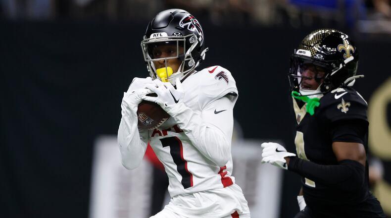 Atlanta Falcons wide receiver Darnell Mooney (1) catches a pass for a touchdown against New Orleans Saints cornerback Kool-Aid McKinstry, right, in the second half of an NFL football game, Sunday, Nov. 23, 2025, in New Orleans. (AP Photo/Butch Dill)