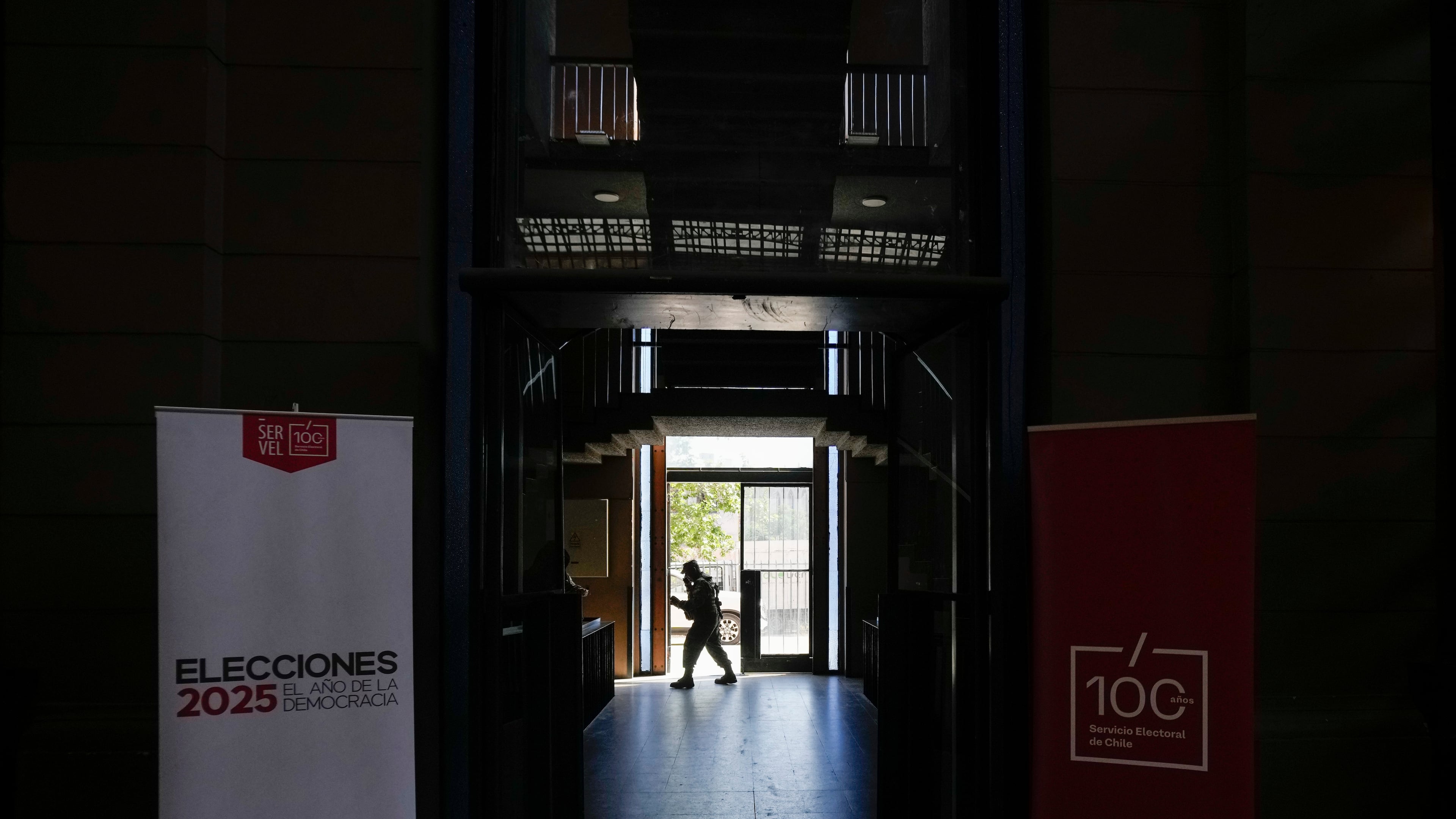 Soldier guard the old Mapocho train station, now a cultural center, that will be used as a polling station for the general election in Santiago, Chile, Friday, Nov. 14, 2025. (AP Photo/Esteban Felix)
