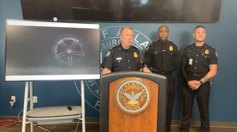 Atlanta police Chief Darin Schierbaum (left) speaks during a news conference about street racing Sunday afternoon.