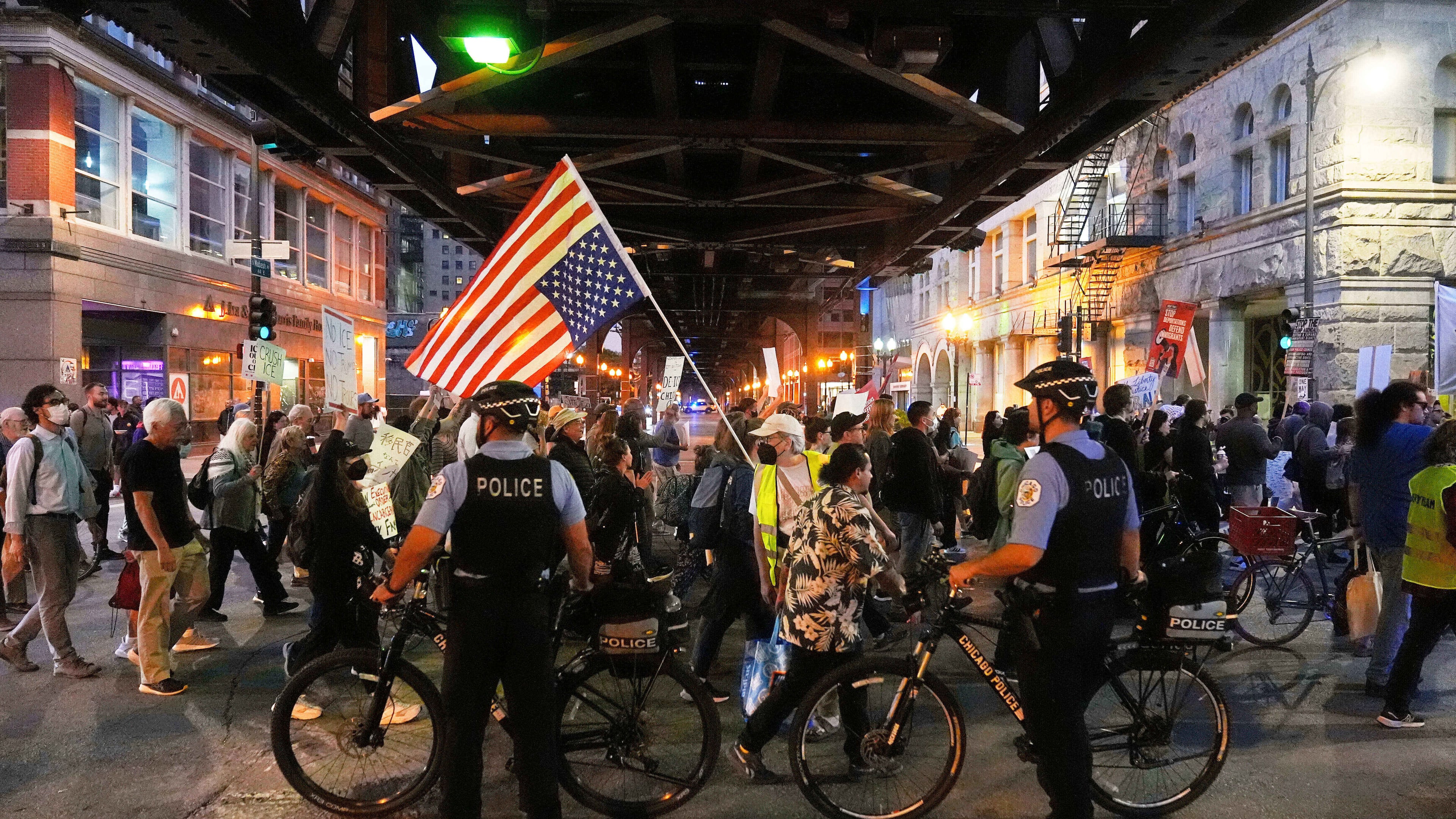 FILE - Police officers block a street as demonstrators march at a protest opposing "Operation Midway Blitz" and the presence of ICE, Sept. 9, 2025, in Chicago. (AP Photo/Erin Hooley, File)