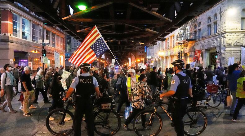 FILE - Police officers block a street as demonstrators march at a protest opposing "Operation Midway Blitz" and the presence of ICE, Sept. 9, 2025, in Chicago. (AP Photo/Erin Hooley, File)