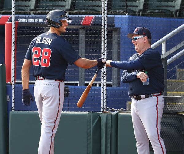 031622 North Port: Atlanta Braves newly signed first baseman Matt Olson gets a fist bump from hitting coach Kevin Seitzer after ripping a single off pitcher Charlie Morton during his first plate appearance with the team during live batting practice at Spring Training at CoolToday Park on Wednesday, March 16, 2022, in North Port.    “Curtis Compton / Curtis.Compton@ajc.com”