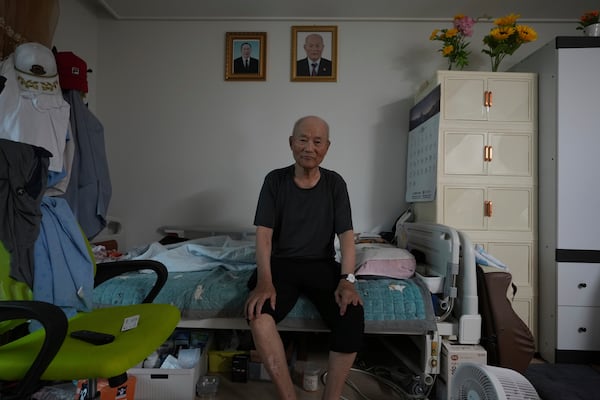 Lee Seon-wu, 94, a former South Korean soldier, lost three fingers and was captured by Chinese troops during a fierce battle in the eastern Gangwon province in the final days of the Korean War, poses for a photo before an interview at his home in Gimpo, South Korea, on June 20, 2025. (AP Photo/Lee Jin-man)