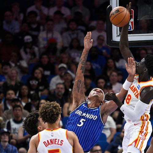 Hawks forward Mouhamed Gueye (center right) blocks a shot by Magic forward Paolo Banchero on Friday, Oct. 24, 2025, in Orlando, Fla. The Hawks scored a 111-107 win over the Magic. (Phelan M. Ebenhack/AP)