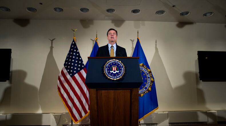 FBI Director James Comey makes a statement at FBI Headquarters in Washington, Tuesday, July 5, 2016. Comey said the FBI will not recommend criminal charges in its investigation into Hillary Clinton's use of a private email server while secretary of state. (AP Photo/Cliff Owen)
