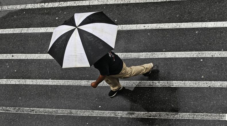 Woodstock is seeking $140,000 from the state to keep pedestrians safe while crossing a busy street. AJC FILE