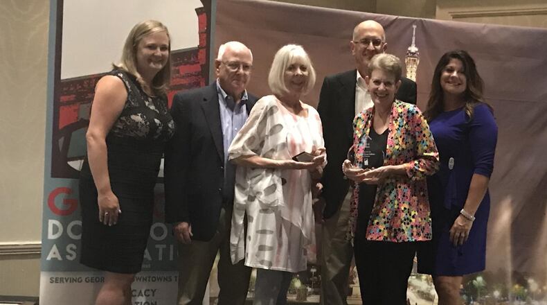 Janis and Paul Beavin, Robin and David Sullivan, and the North Gwinnett Arts Association representatives accept Downtown Excellence Awards at the 2018 Georgia Downtown Association Conference at Chateau Elan. Courtesy City of Suwanee