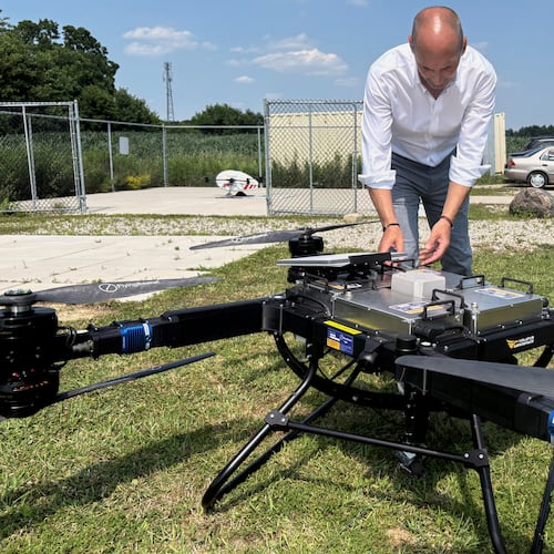 Volatus Aerospace COO Greg Colacitti inspects a heavy lift drone before a test run on July 13, 2026, in Kleinburg, Ontario. (AP Photo/Kelvin Chan)